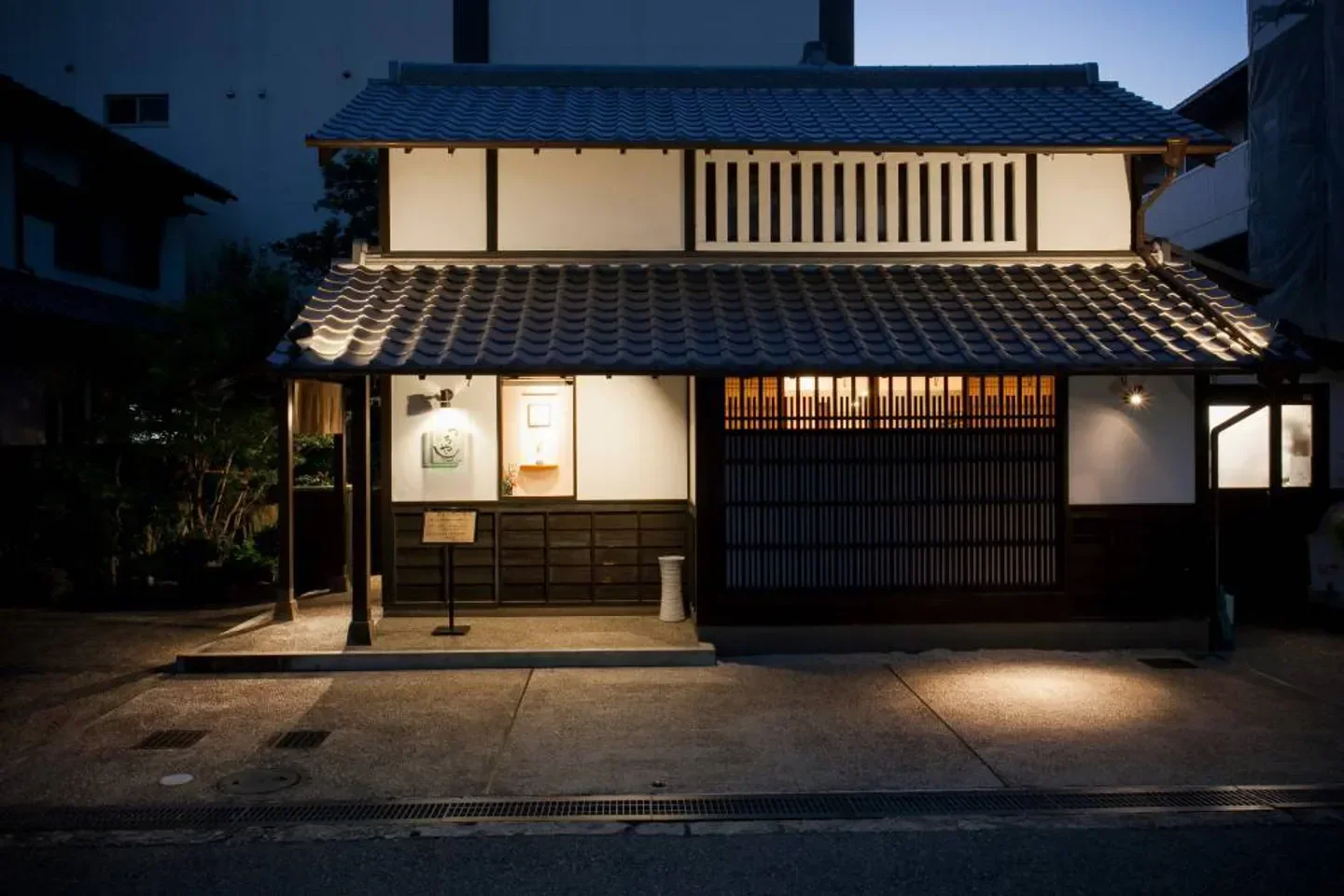 Exterior view of Shunsaiten Tsuchiya in Osaka at night, traditional Japanese restaurant.