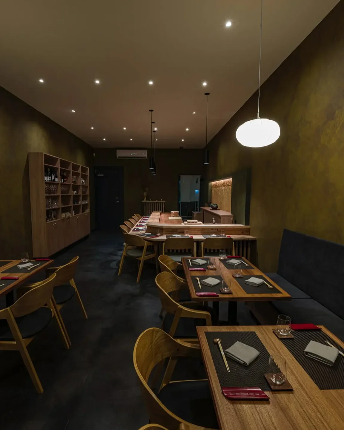 Interior of Shusai Mijo restaurant in Melbourne, featuring wooden tables and elegant decor