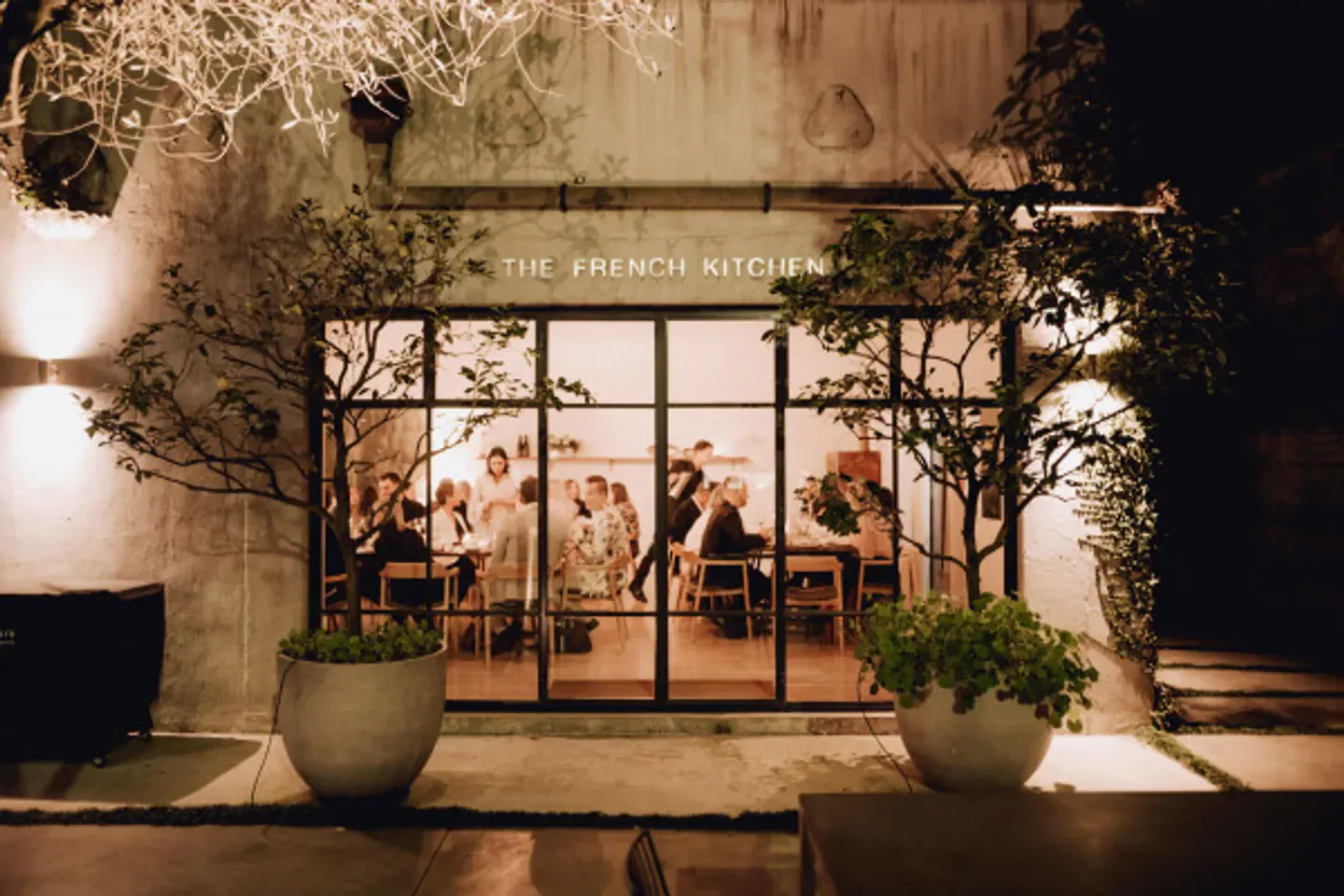 Exterior view of Sid at The French Café in Auckland, with diners enjoying the restaurant.