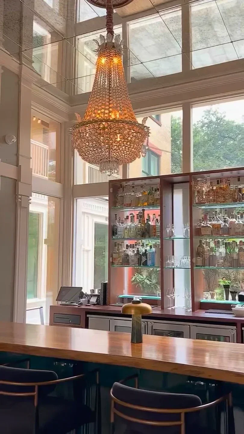 Elegant chandelier and bar at SILO Prime restaurant in San Antonio.