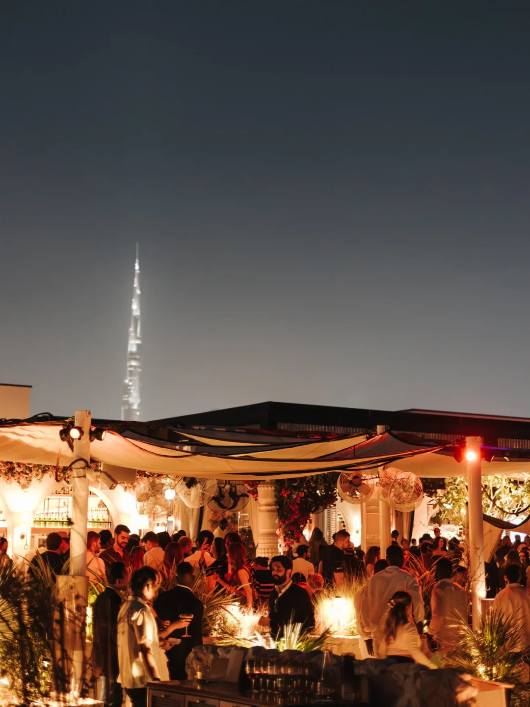 Vibrant rooftop view at Sirene by Gaia beach club in the city, with Burj Khalifa visible.