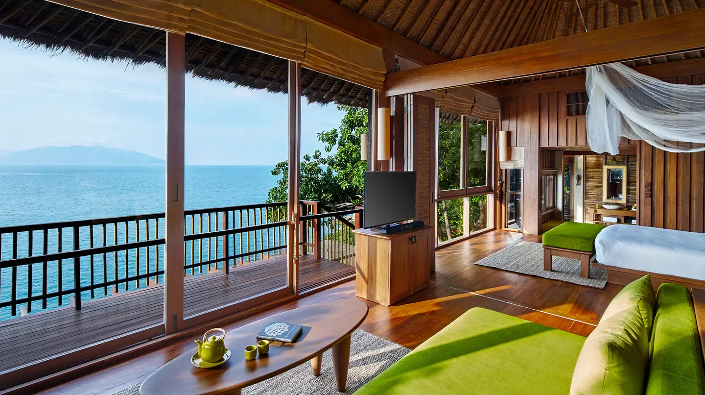 Ocean view suite at Six Senses Hideaway Samui in Koh Samui with wooden interior.