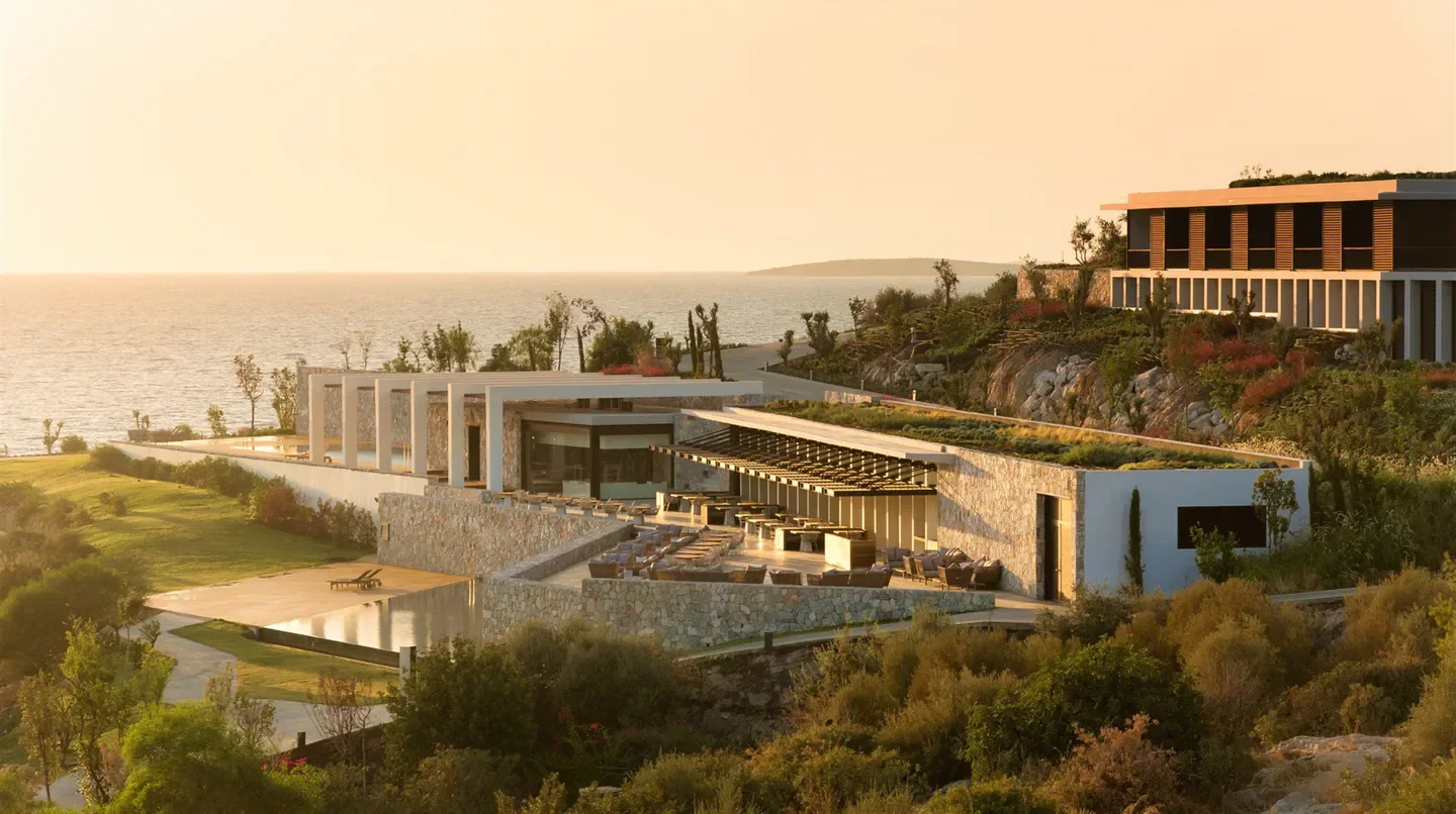 Coastal view of Six Senses Kaplankaya hotel in Bodrum, Turkey, at sunset