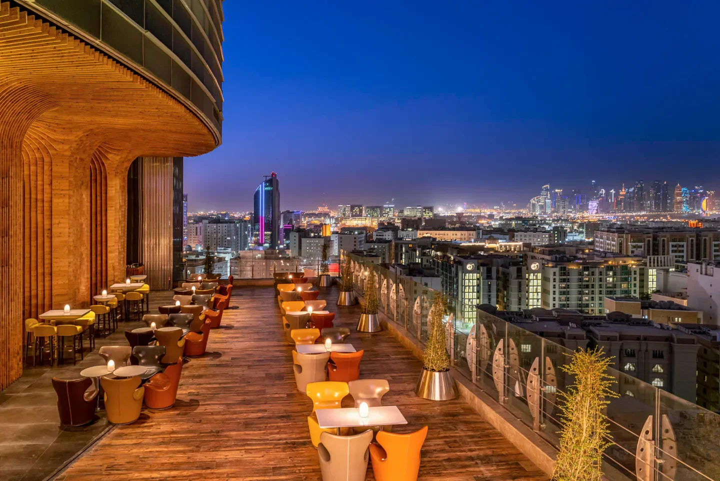 Sky View restaurant in Doha with outdoor seating and city views at night.