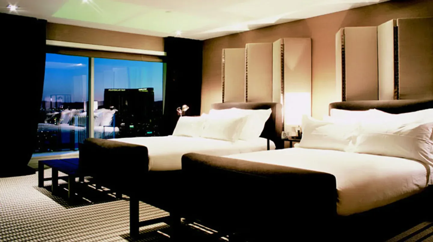 Luxury bedroom at Skylofts at MGM Grand in Las Vegas with city views.
