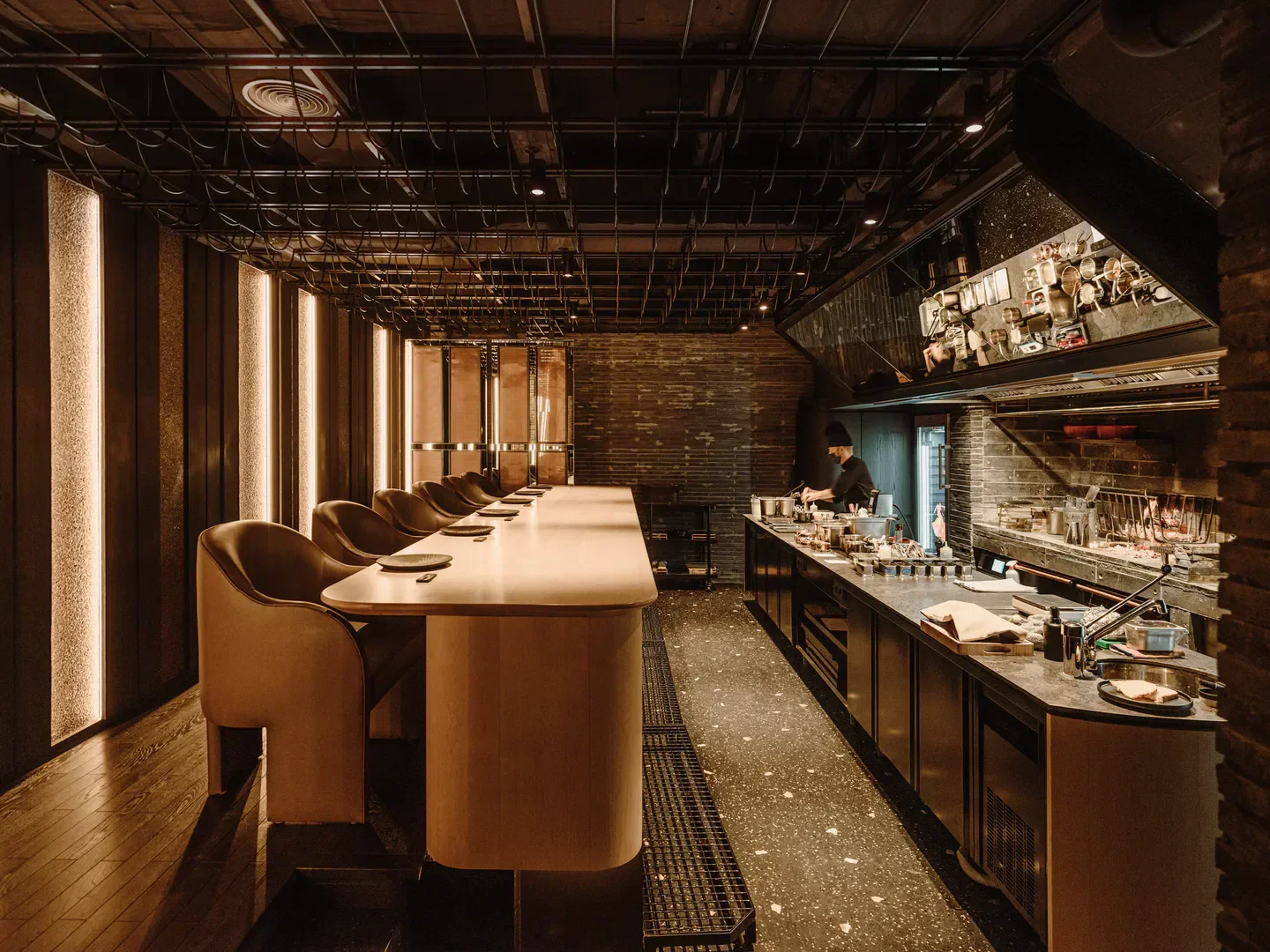 Interior of Smoked Room in Madrid, featuring chef and stylish dining area.