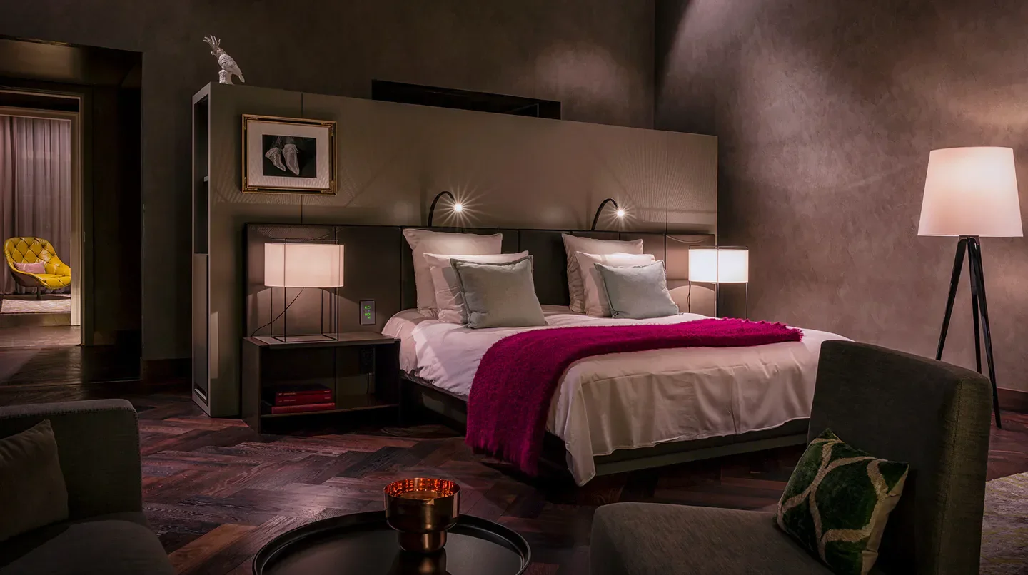 SO/ Berlin Das Stue hotel room in Berlin: luxurious bedroom with modern decor and lights