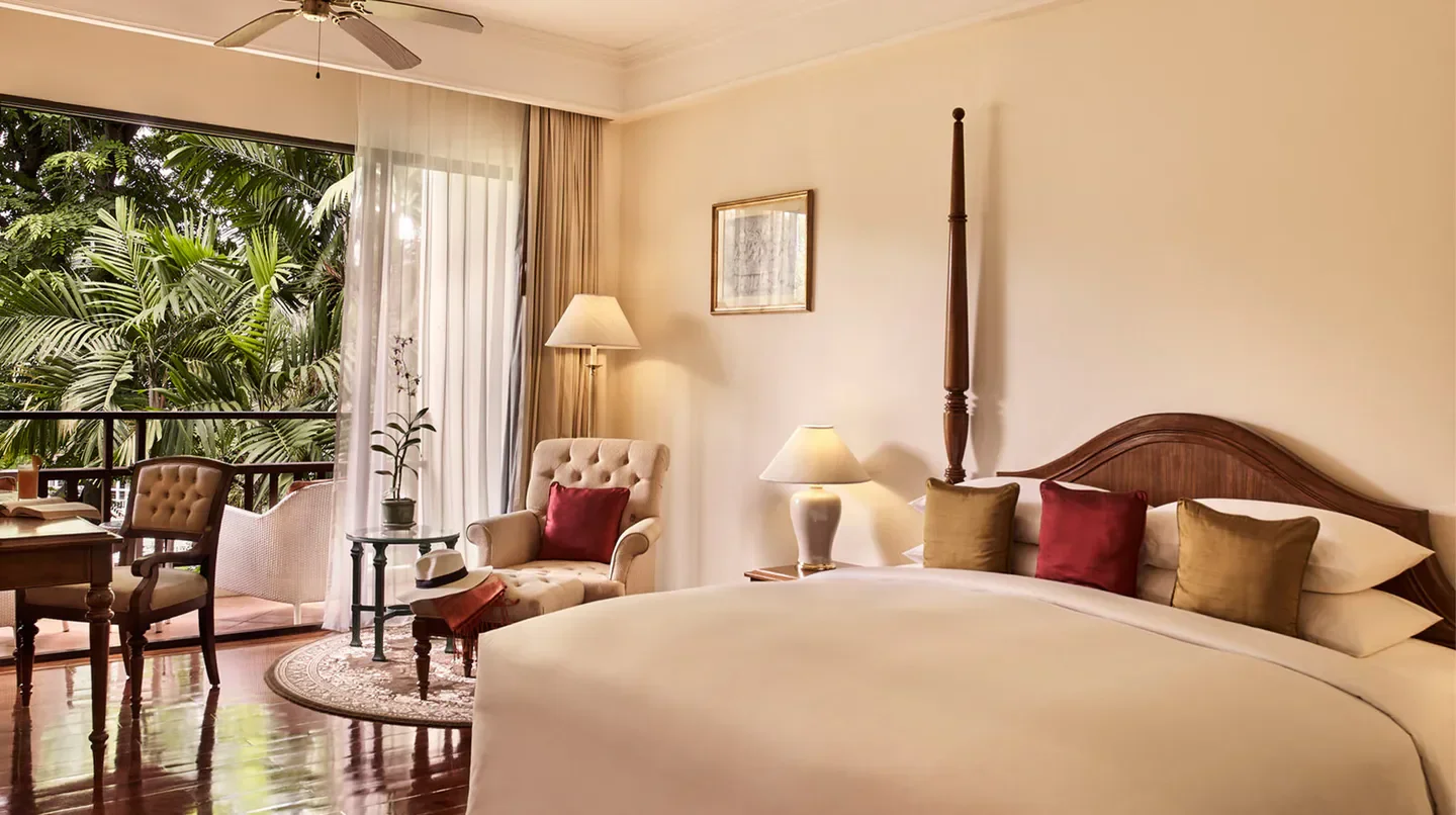 Elegant bedroom at Sofitel Angkor Phokeethra Golf & Spa Resort in Siem Reap, with balcony views.