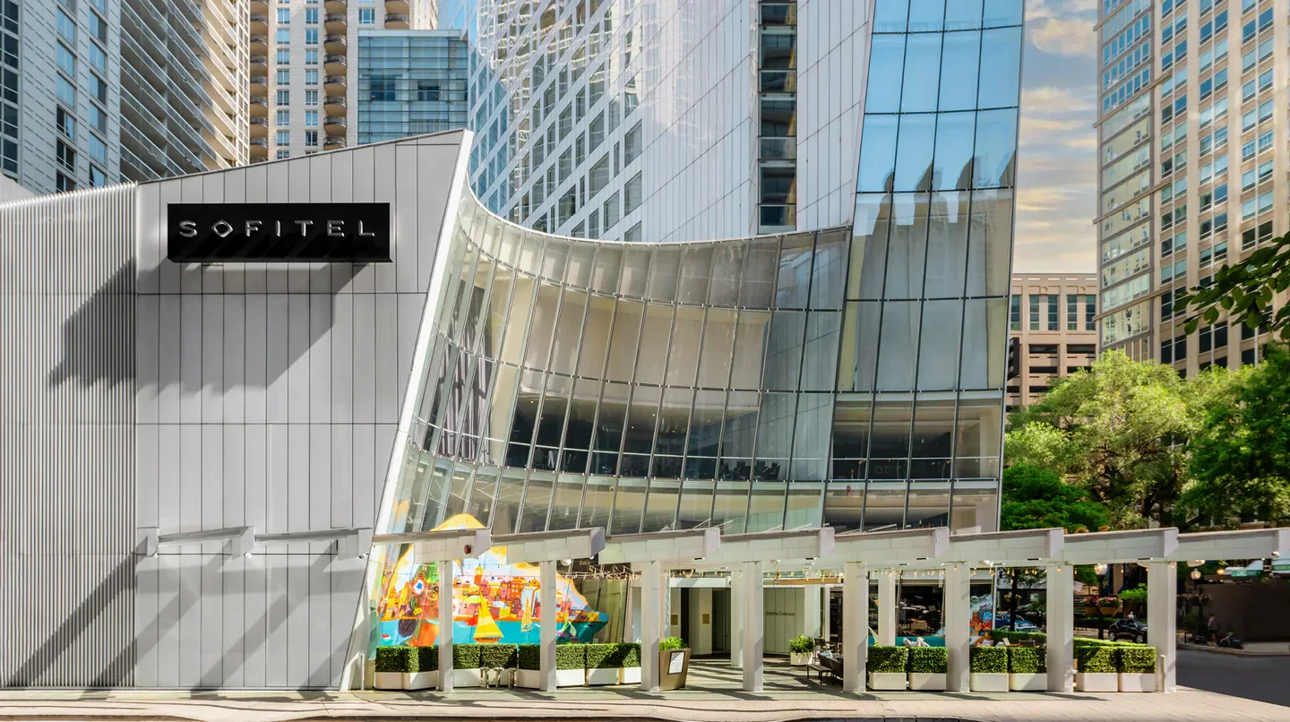 Exterior of Sofitel Chicago Magnificent Mile hotel in Chicago, showcasing modern architecture.