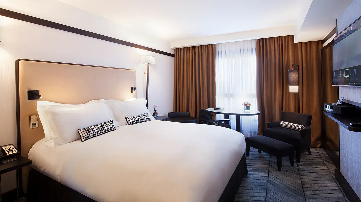 Cozy bedroom at Sofitel Lisbon Liberdade, featuring luxurious design in Lisbon