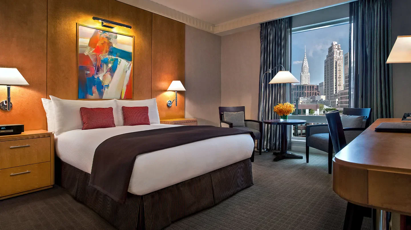 Cozy hotel room at Sofitel New York, featuring views of New York City skyline.