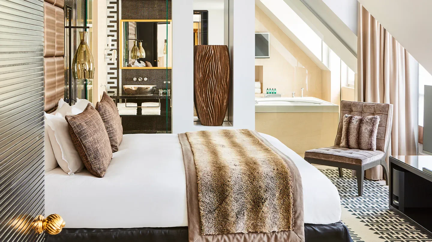 Luxury hotel room at Sofitel Paris Le Faubourg, with a view of Paris, France.