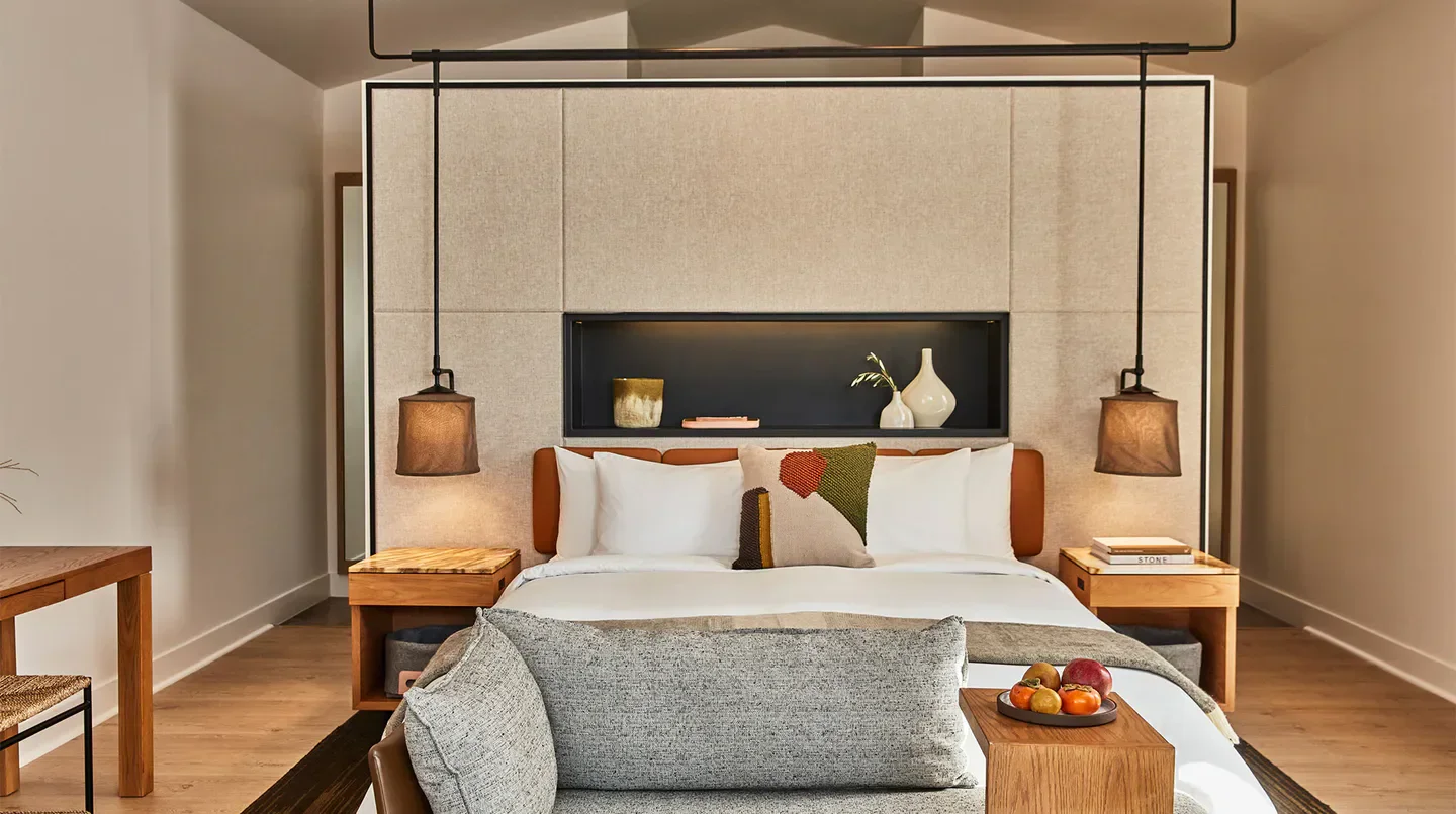 Cozy bedroom at Solage, Auberge Resorts Collection in Napa Valley, featuring warm decor.