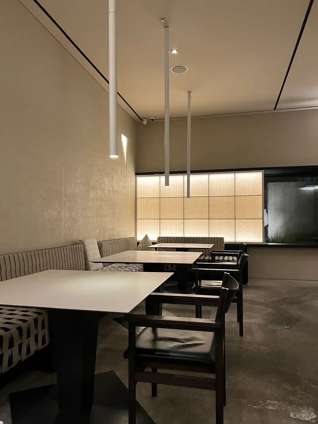 Interior of Soseoul Hannam restaurant in Seoul with modern tables and lighting.