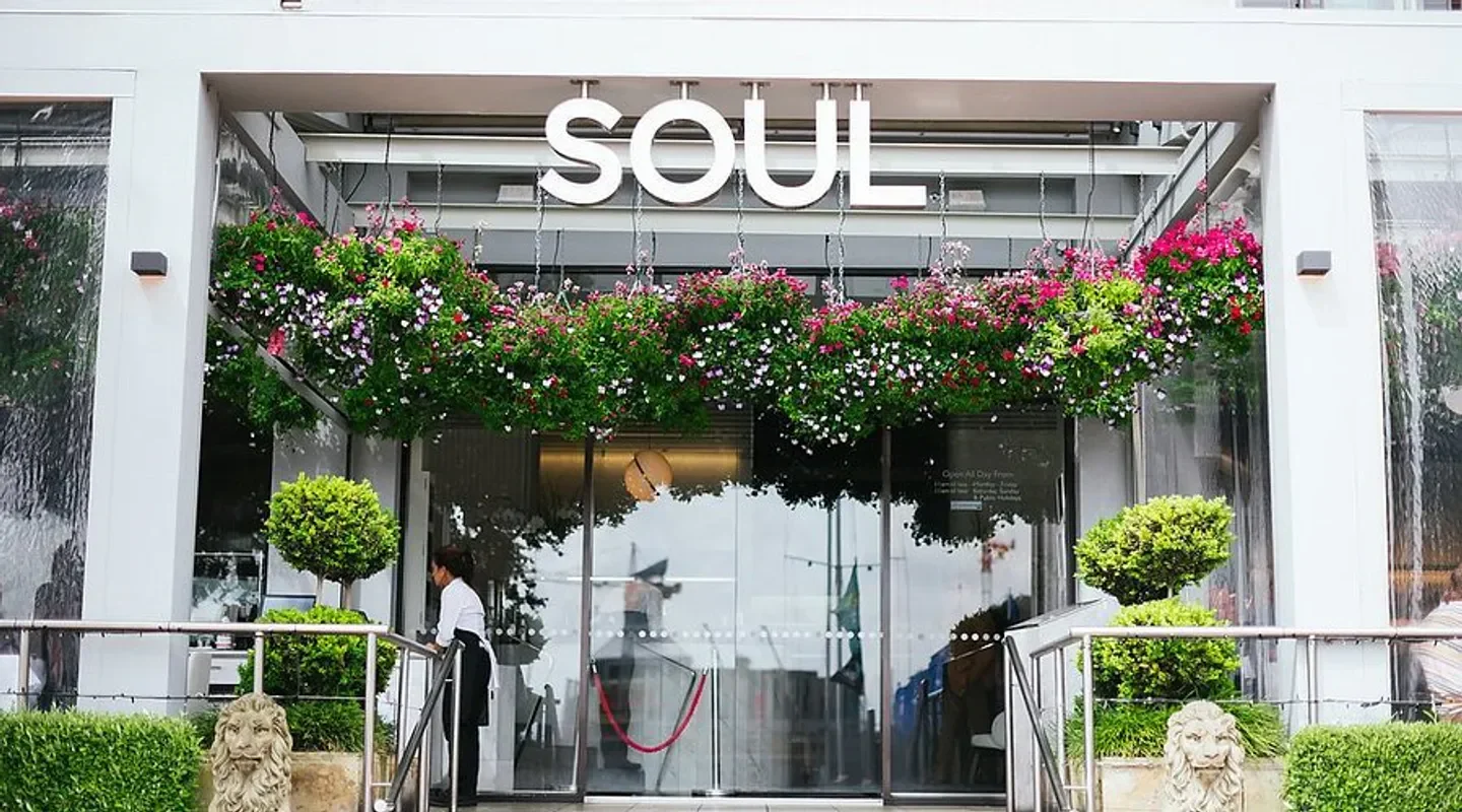 Entrance of Soul Bar & Bistro in Auckland, with hanging flowers and stylish facade