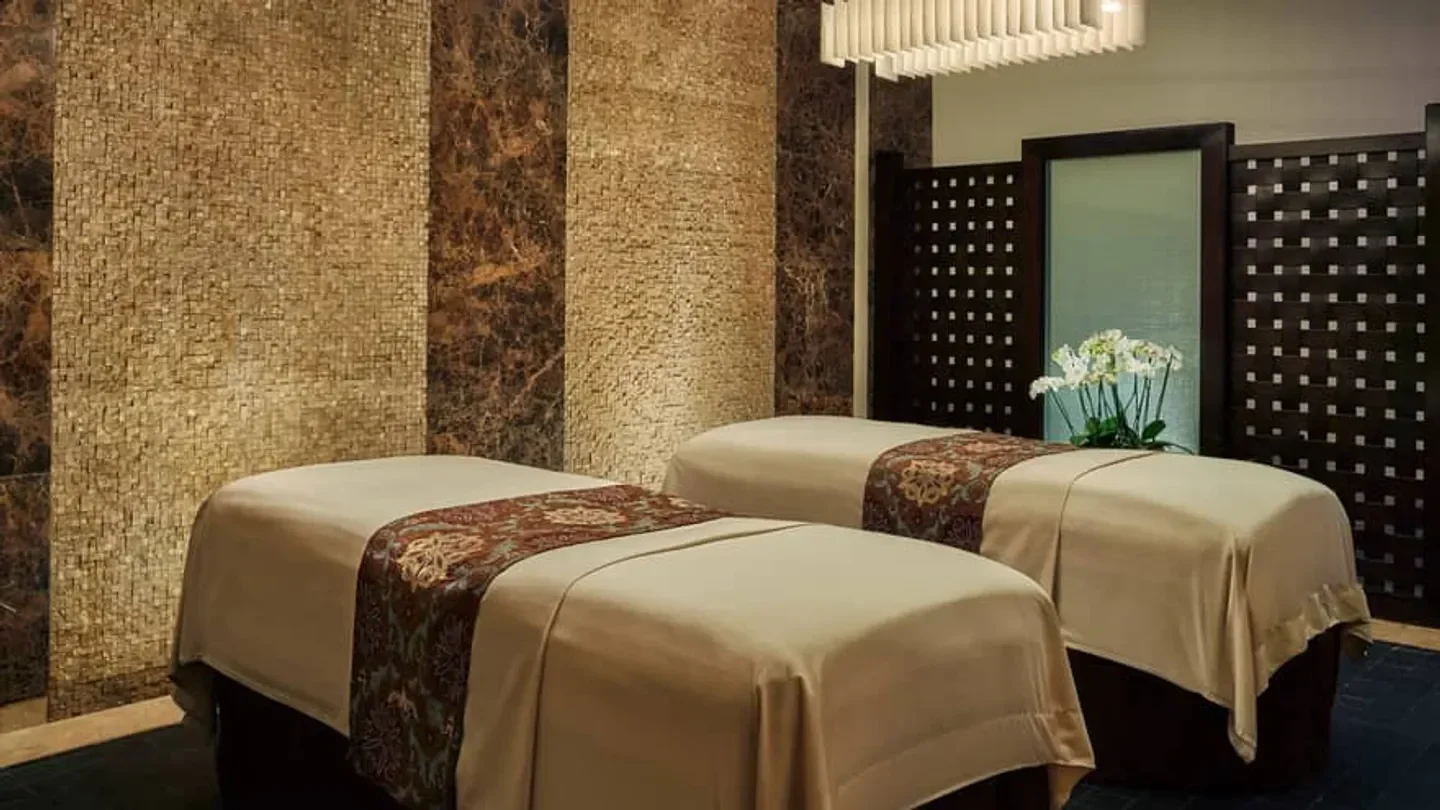 Spa treatment room at Spa and Wellness Centre at Four Seasons Hotel Doha, Doha.