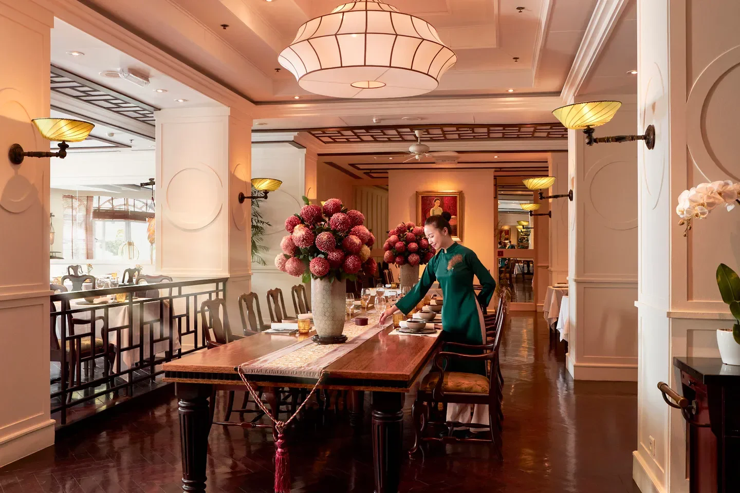 Elegant dining room at Spices Garden restaurant in Hanoi, Vietnam, with floral decor