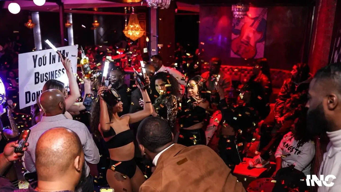 Confetti celebration inside Stars and Spirits nightclub in Dallas, with people dancing and enjoying the night