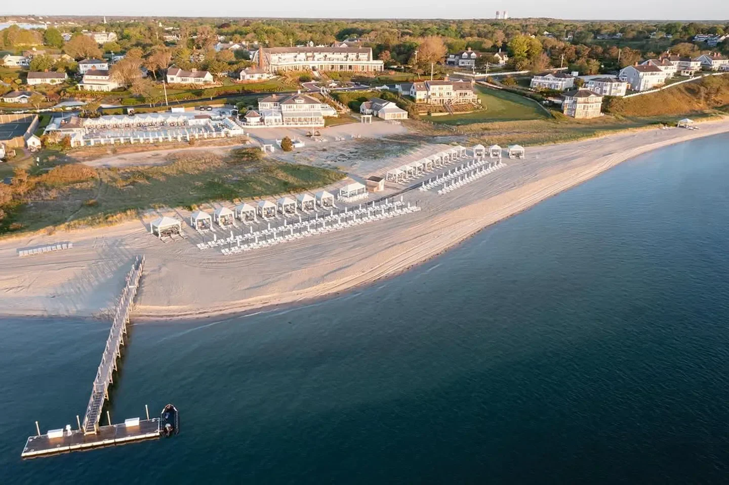 Aerial view of STARS restaurant on the beach in Cape Cod, showing cabanas and water.