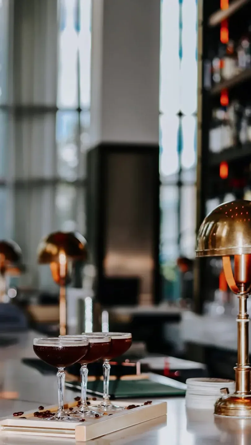 Cocktails on the bar at Stock Hill in Kansas City, showcasing the restaurant's elegant interior