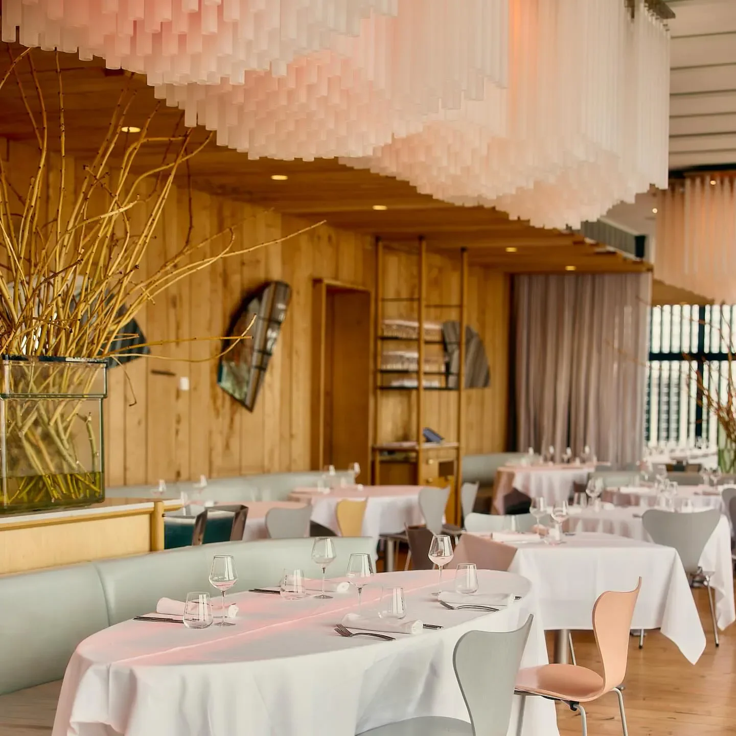 Elegant dining room interior at Stokehouse restaurant in Melbourne, with tables set for service.