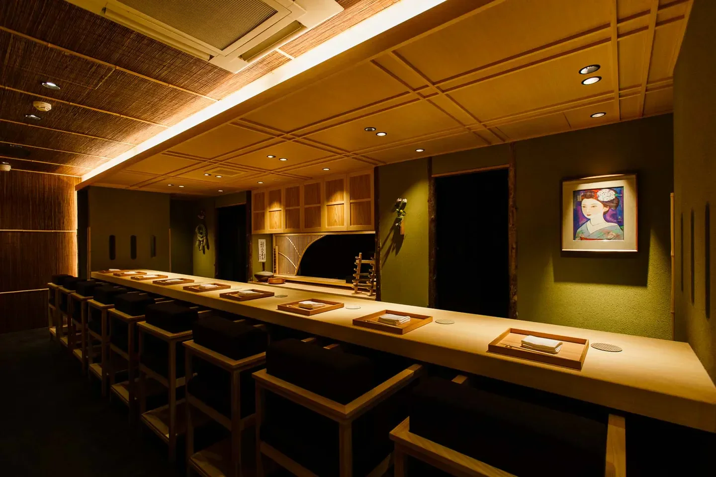 Interior of Sumibi Kappo Ishii in Osaka: warm lighting and minimalist design.