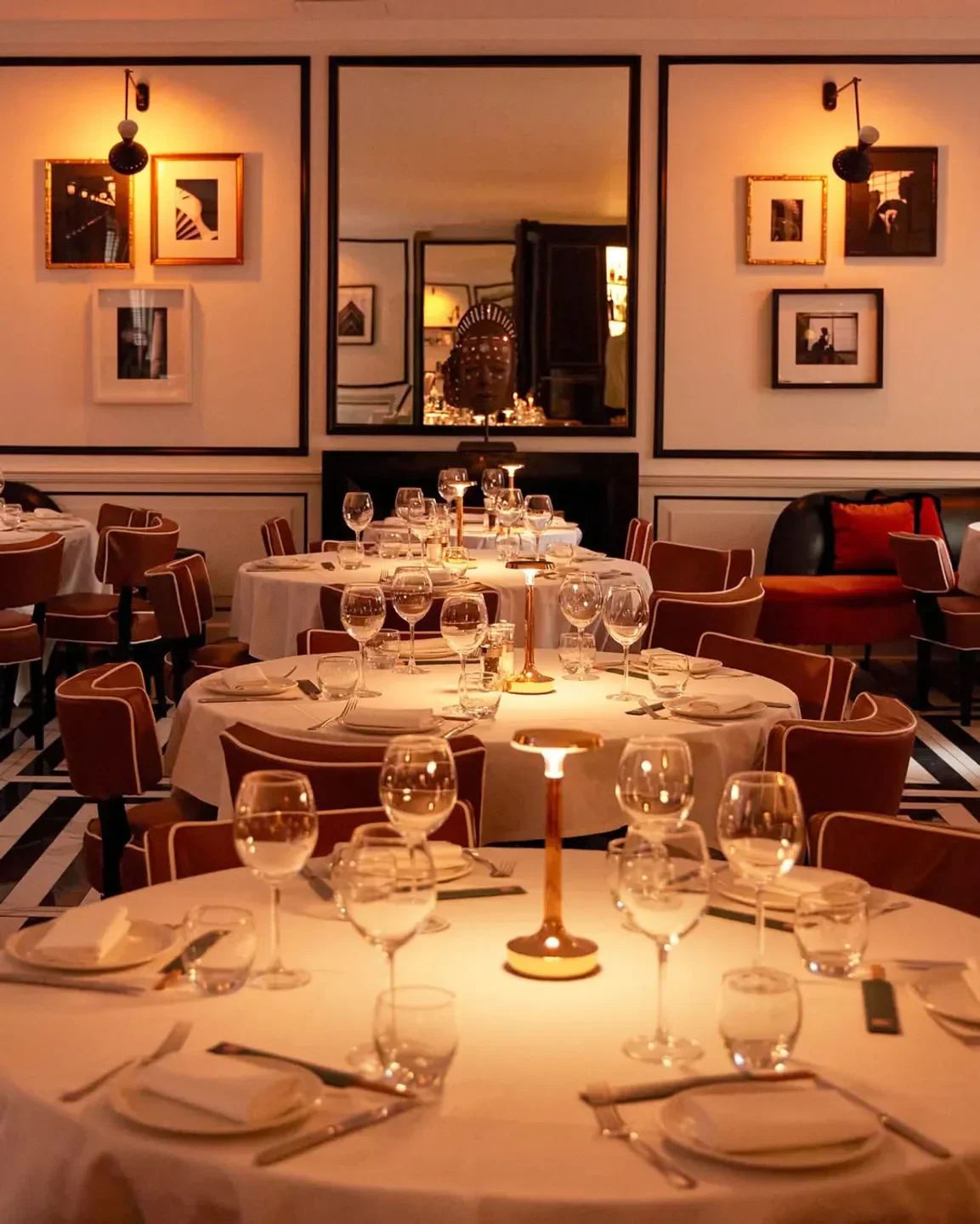 Elegant dining room interior at Sumosan Twiga in London, featuring tables, chairs, and artwork.