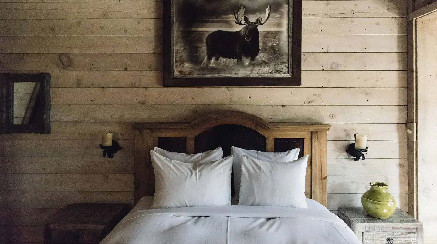 Cozy bedroom at Sundance Mountain Resort in Park City, Utah, with rustic decor.