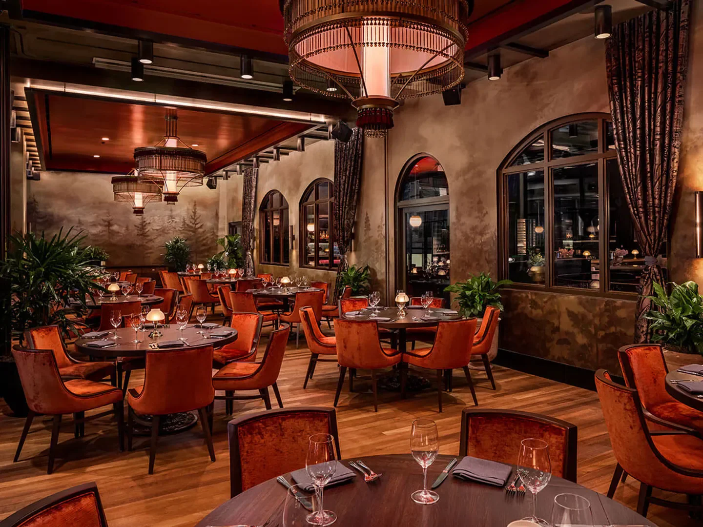 Elegant dining room at Supper Club at The Twelve Thirty Club in Nashville, featuring orange chairs.