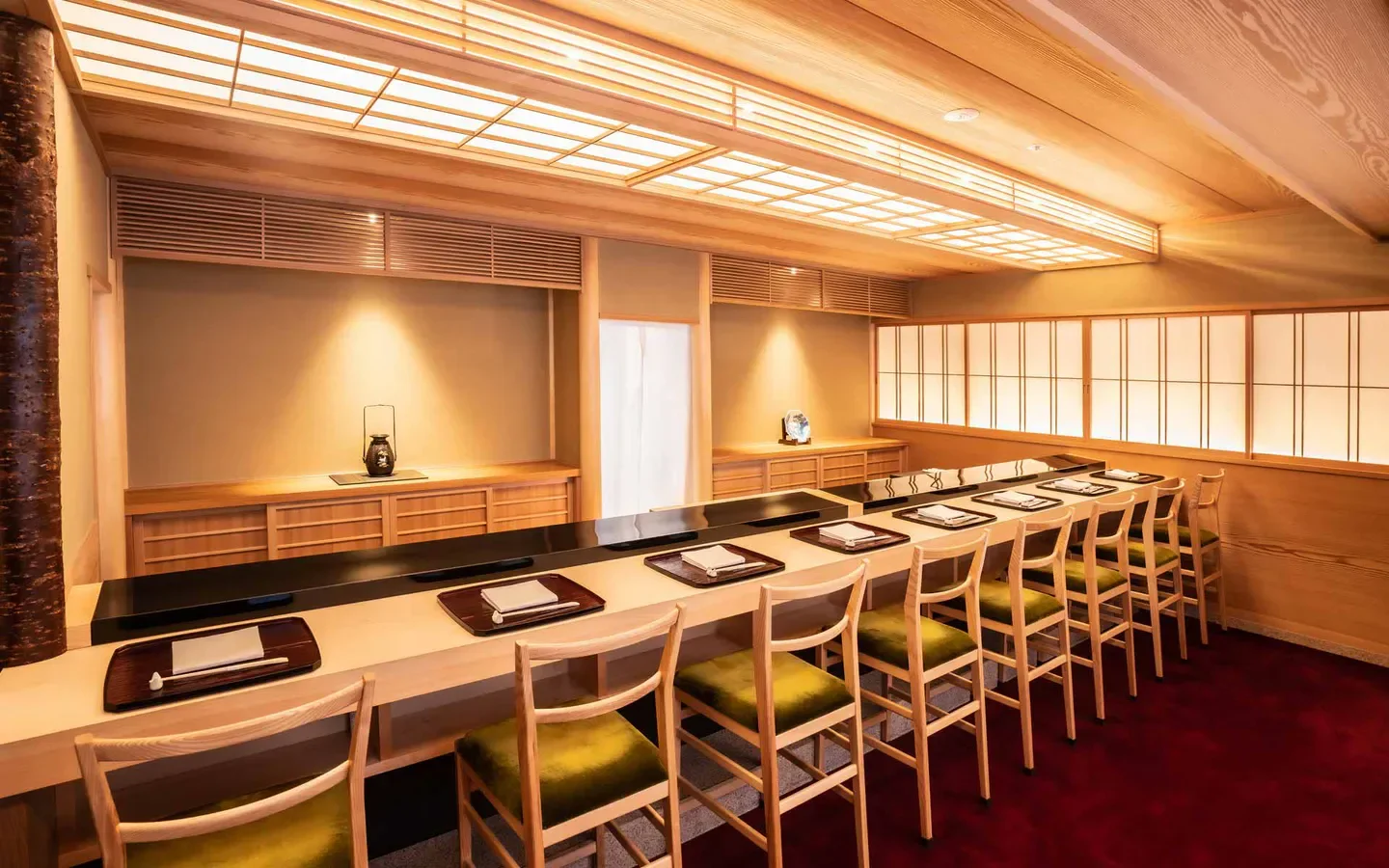 Interior of Sushi Arai in Tokyo, with elegant wooden design and seating at the bar.