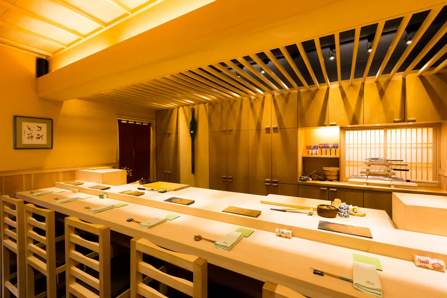Interior of Sushi Ginza Onodera in Honolulu with sushi bar and seating.