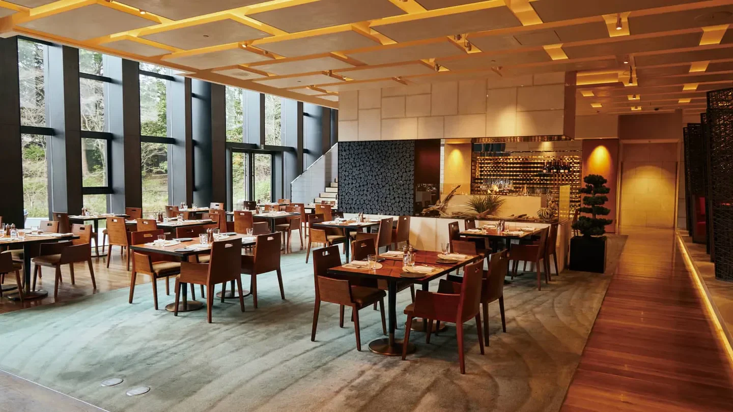 Interior of Sushi Ginza Onodera restaurant in Kyoto, with stylish seating and natural light.