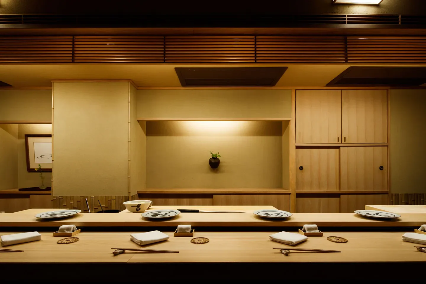 Interior of Sushi Kanesaka in Tokyo, showcasing elegant wood design and dining setup.