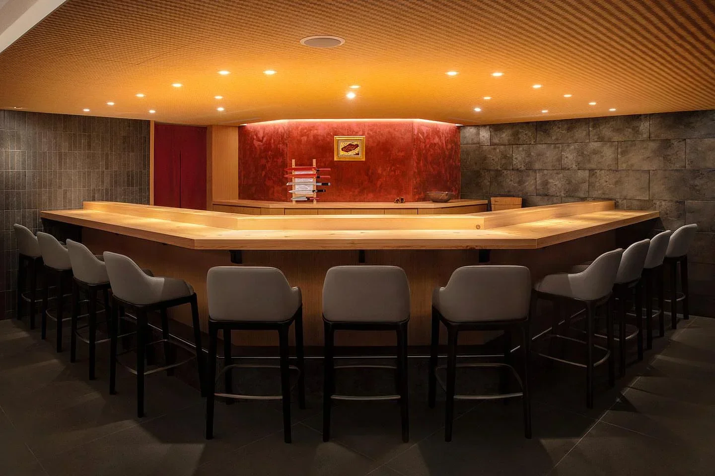 Interior of Sushi Nomura in Taipei, featuring a wooden sushi bar and seating.