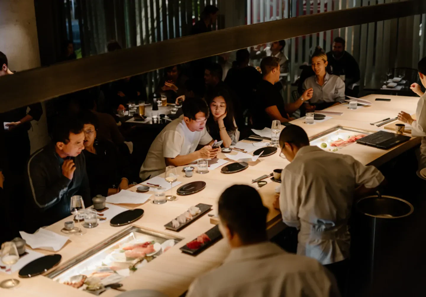 Sushi Room Brisbane: Customers dining at the sushi bar with chefs and prepared dishes