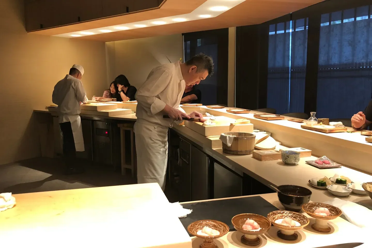 Chef preparing sushi at Sushi Ryu in Taipei, a restaurant known for its exquisite dishes.