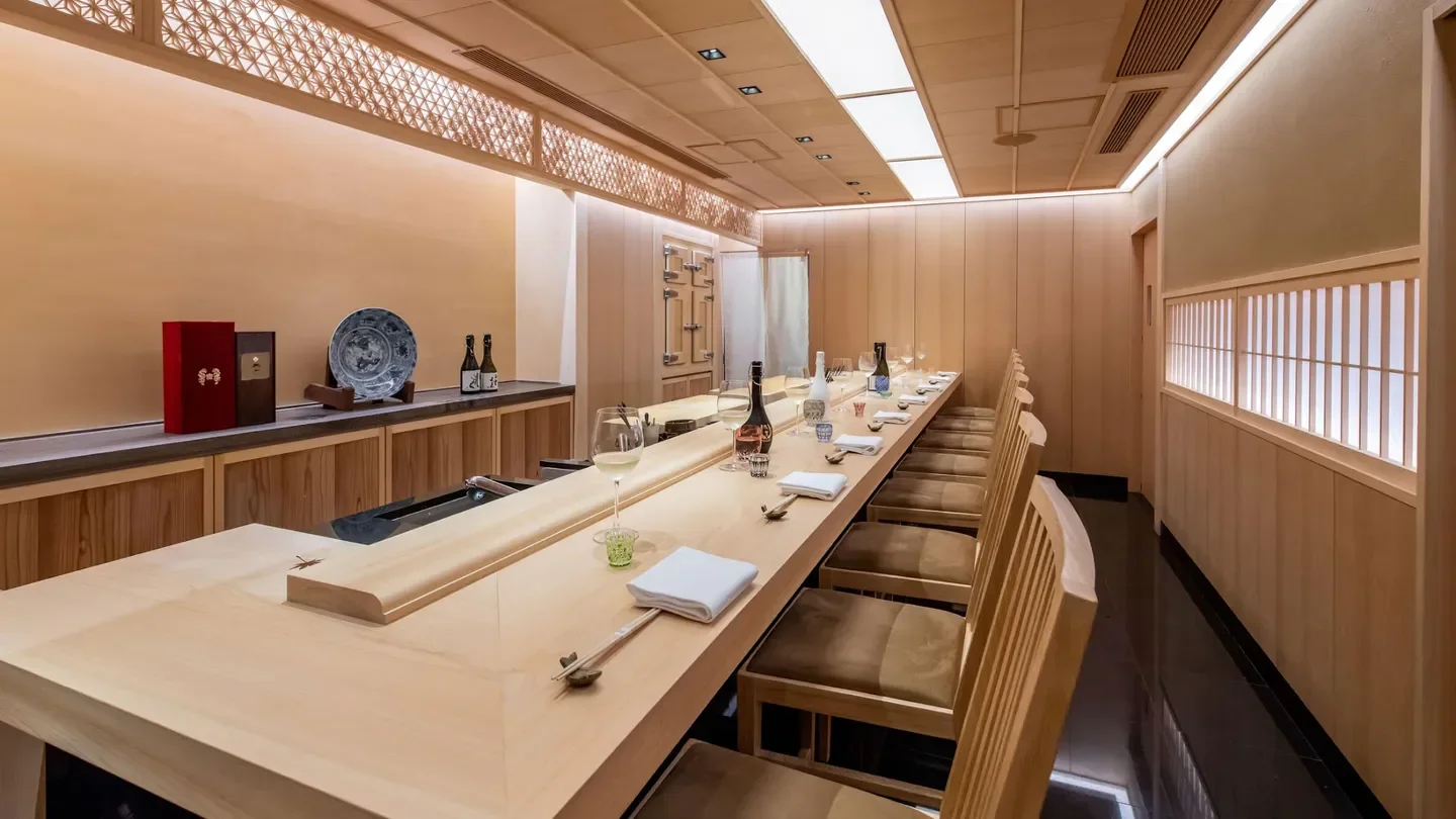 Elegant interior of Sushi Shikon by Yoshitake restaurant in Hong Kong, with sushi bar.