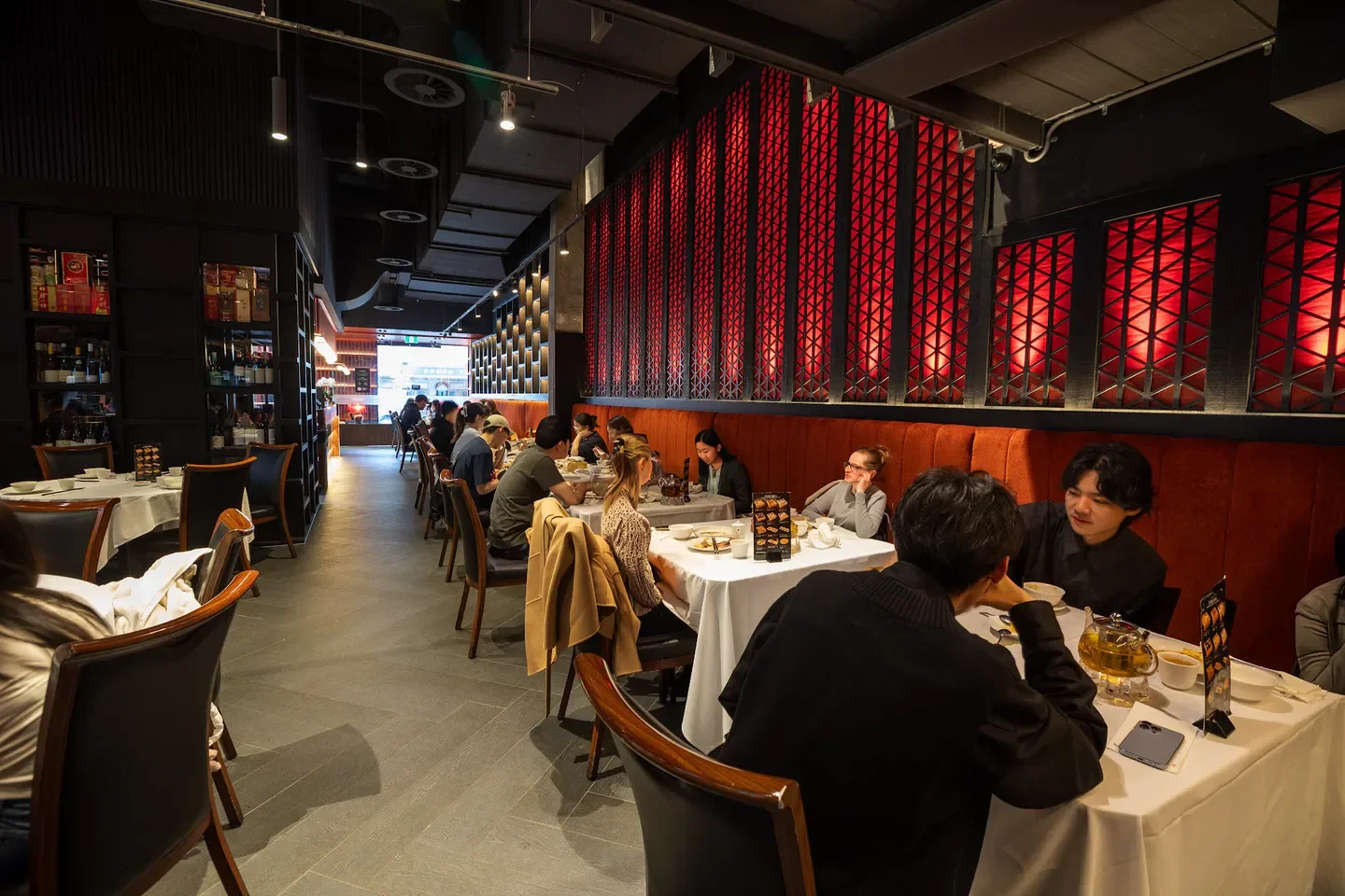Interior dining scene at Table X restaurant in Salt Lake City with red accents.