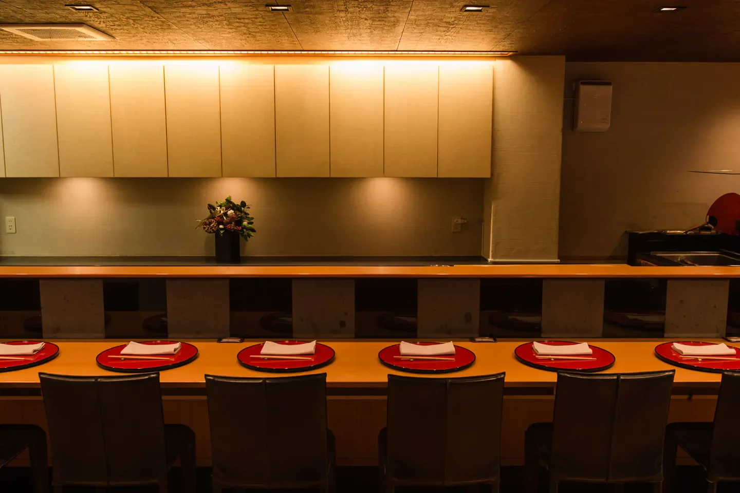 Elegant dining space at Taian restaurant in Osaka, Japan, with seating and place settings.