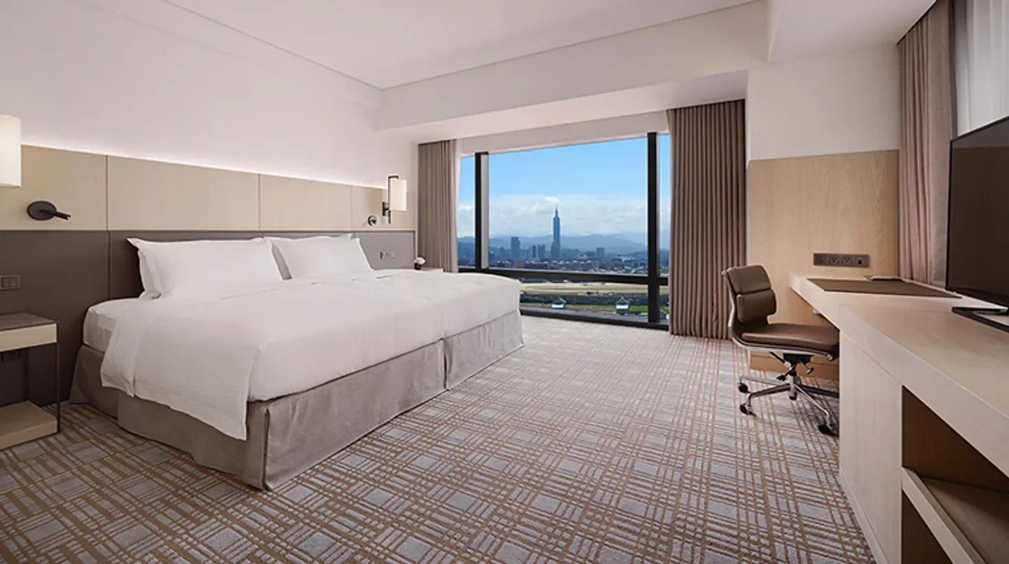Spacious hotel room with city views at Taipei Marriott Hotel in Taipei, Taiwan.