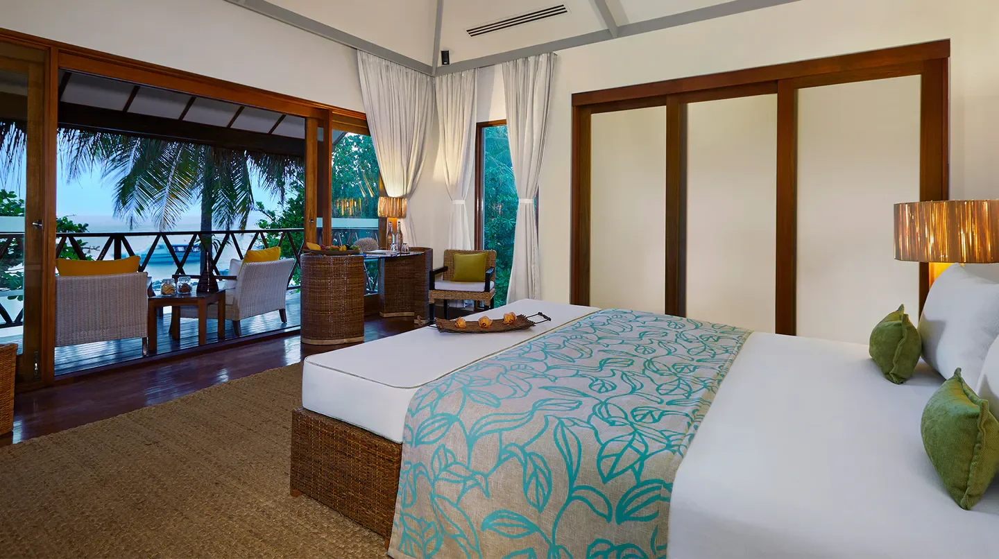 Bedroom with a balcony at Taj Coral Reef Resort & Spa Maldives, in the Maldives, with ocean views
