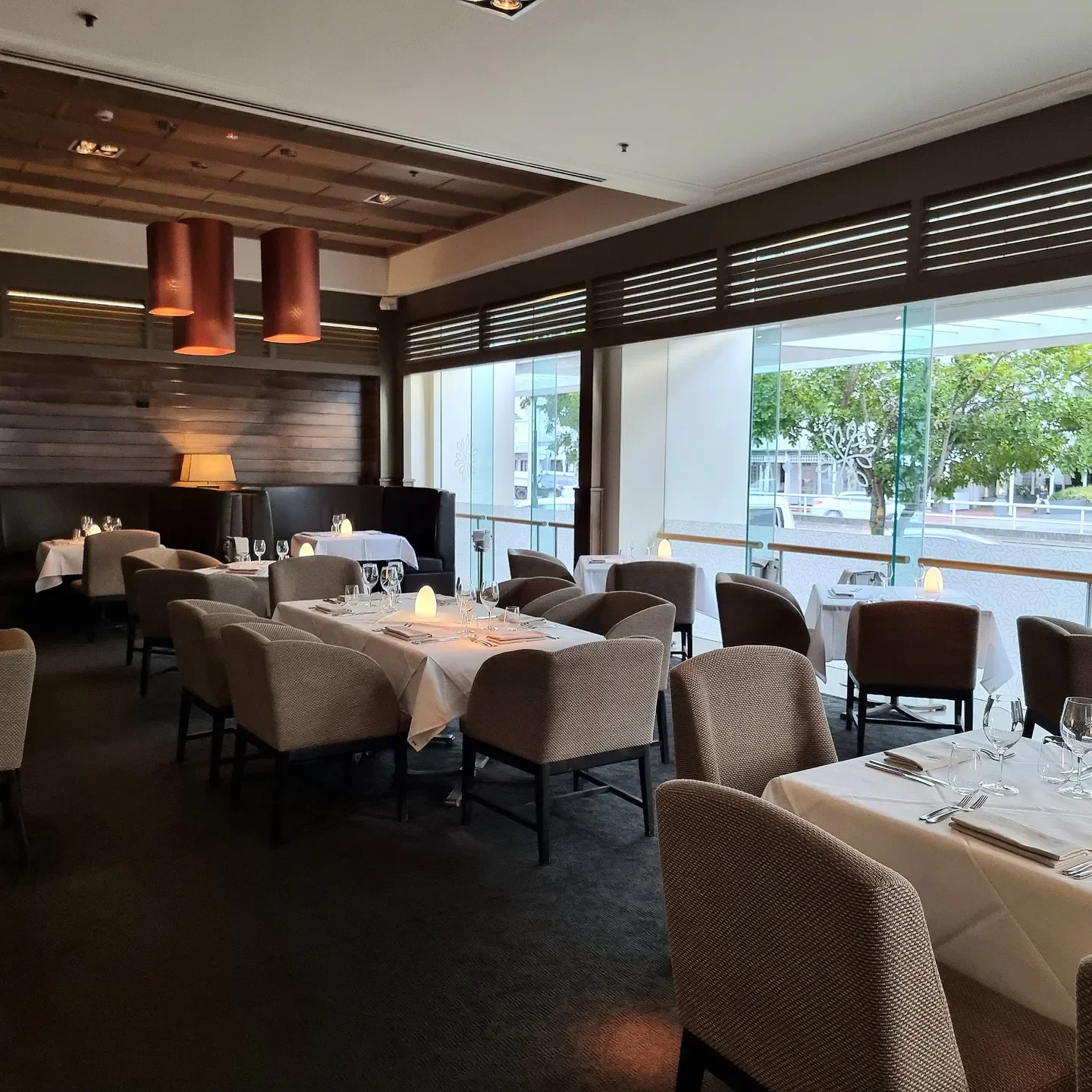 Elegant dining area at Tamarind Restaurant in Cairns, featuring stylish chairs and tables.