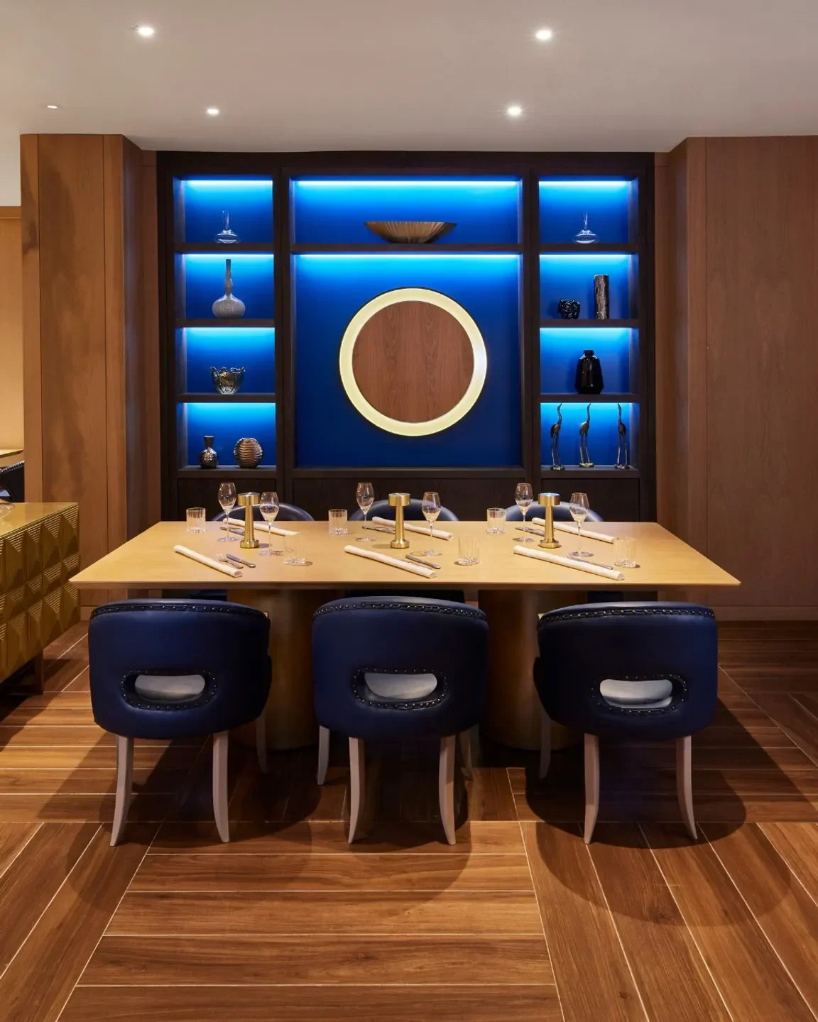 Elegant dining at Tambourine Room by Tristan Brandt in Miami Beach with blue accents.