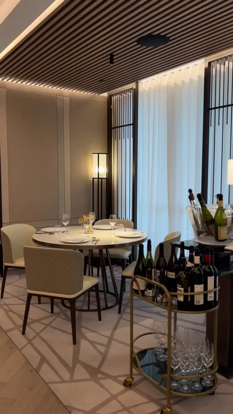 Elegant dining room at T'ang Court restaurant in Gold Coast with wine and table setting.