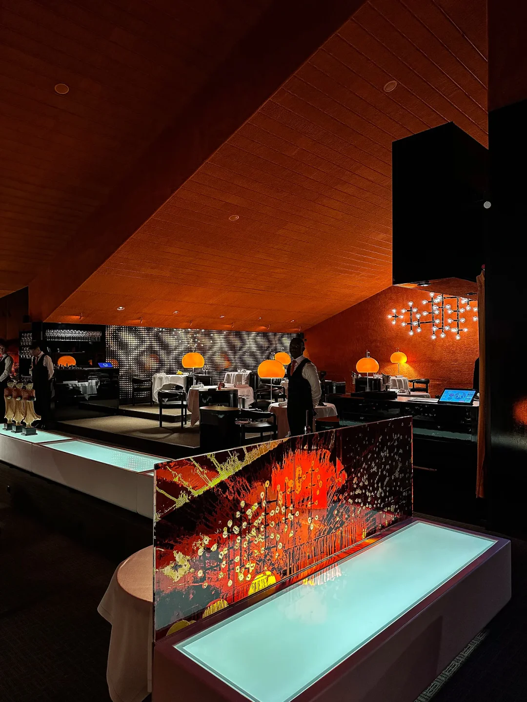 Interior of Tantris DNA restaurant in Munich, featuring modern design and elegant dining setting with warm lighting.