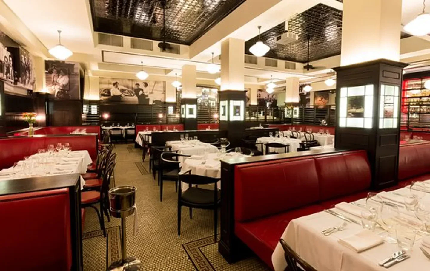 Interior of Tartufo restaurant in Brisbane, showcasing red booths and elegant dining