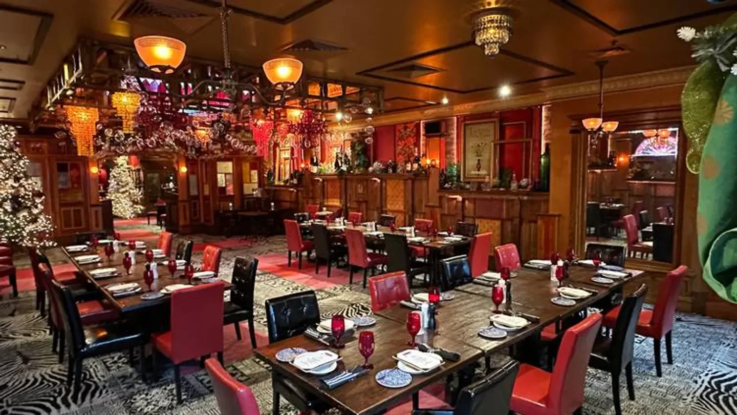 Interior of Tavern Steakhouse Libertyville in Chicago, set tables and festive decor.
