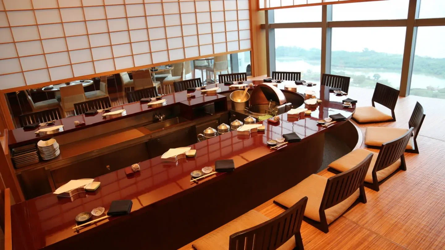Interior of Tenmasa at Altira Macau, with seating and a view in Macau.