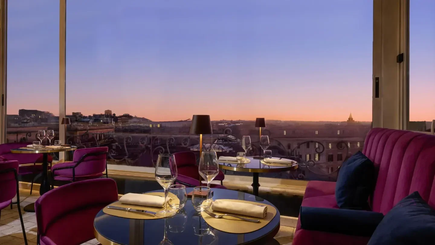 Terrazza Flavia in Rome offers stunning views during sunset over the city.