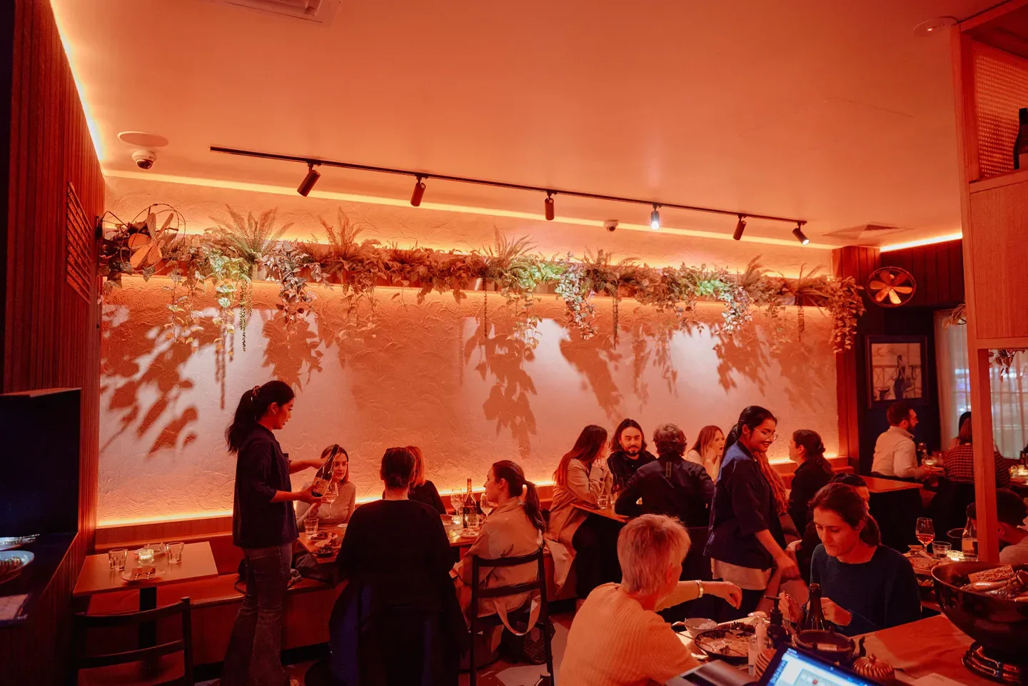 Interior of Thai Tide restaurant in Melbourne, with customers enjoying a meal.